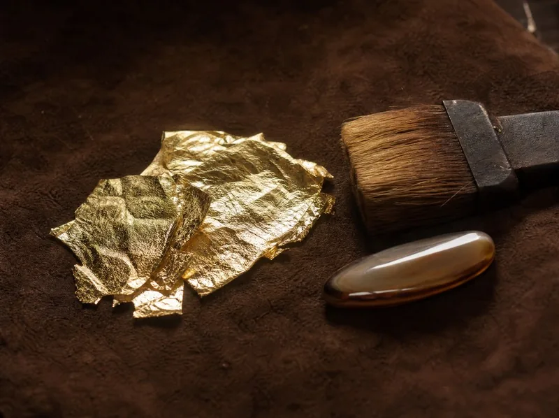 Gilding on the corner of a carved picture frame