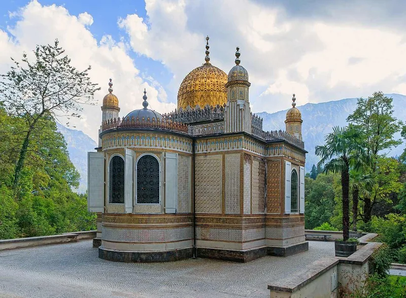 The Moorish Kiosk from the path, its gilded domes above a screen of trees